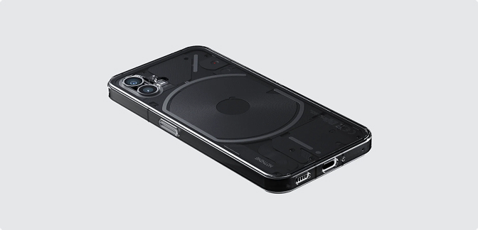 Perspective view of a black Nothing Phone lying flat, showing its transparent back design, circular wireless charging coil, and internal mechanical textures.